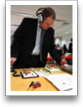 A. Roach listens with Wireless Headphones for TV Viewers.